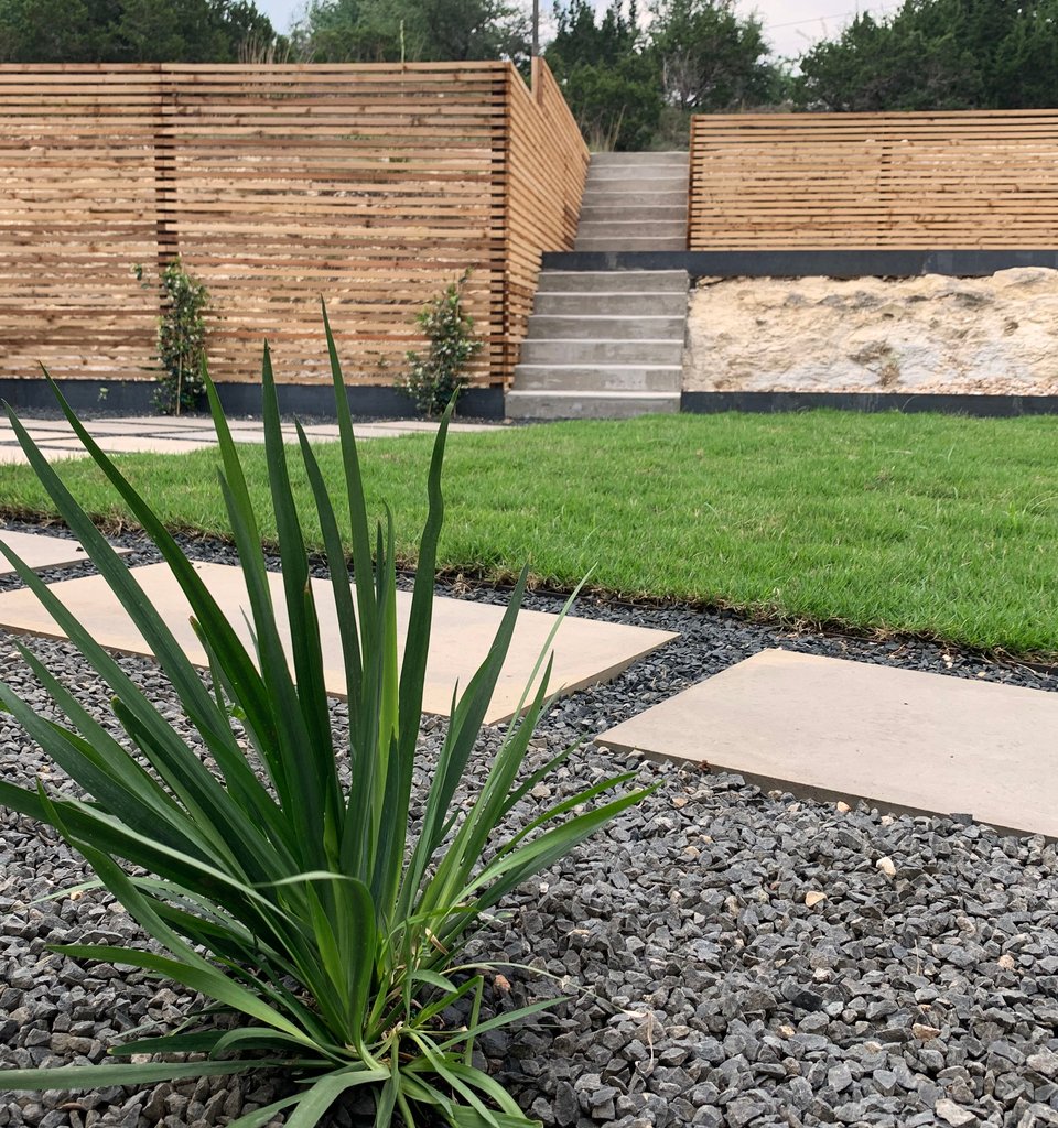 Westlake Hills modern terrace with cedar slat fence and limestone pavers