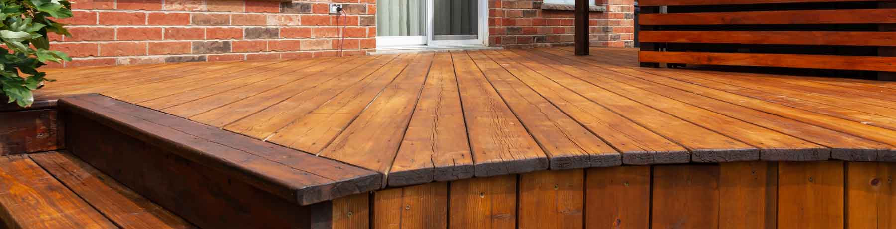 Stained house deck | Thrive Landscape & Design